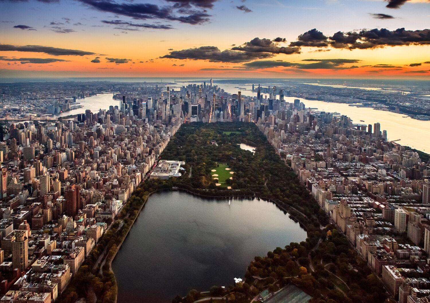 Aerial view of New York City captured from above the Central Park at sunset.