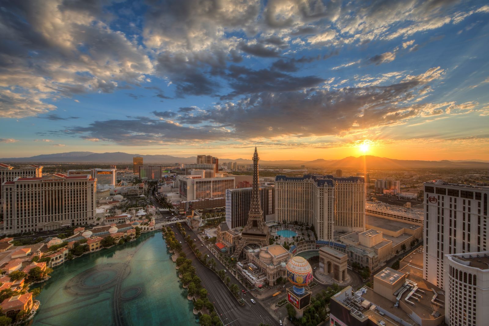 A panoramic view of urban downtown Las Vegas with blue sky and sunshine in background